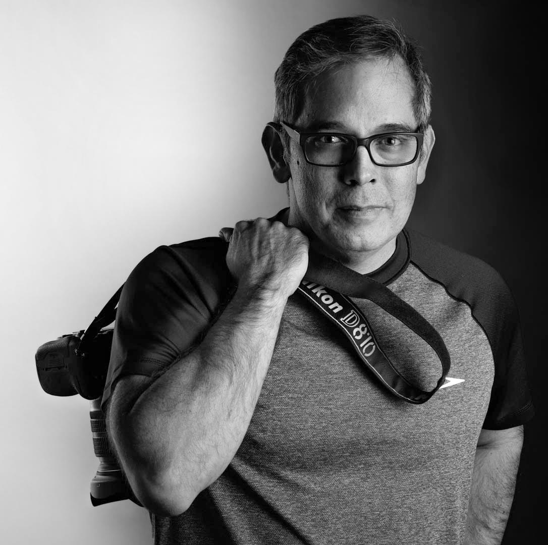 Juan Carlos Paz, founder and photographer at 360 Media Drone, holding his camera